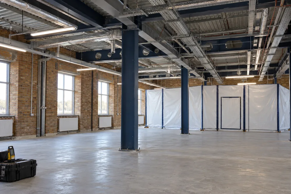 Vacant commercial warehouse with exposed building fabric